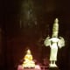 two Buddha statuettes. One depicts Knowledge and Power, the other is wisdom personified.