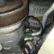 AC compressor leaking freon with a fluorescent dye tracer. The leak is most likely caused by a damaged o-ring between the AC compressor and AC line. This leak could be found easily with an ultraviolet light.