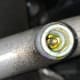 Leaking Schrader valve at the AC charging port.