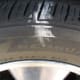 The inner front tire is lightly loaded when turning away from it. The outer fourth of the tread isn't touching the pavement enough to scrub off the chalk!