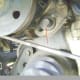 K. Loosen and remove the power steering pump bracket bolt.