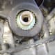 O. Crankshaft pulley removed, exposing lower timing belt cover