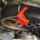 HH. Stretch the belt onto the left camshaft sproket. Secure the belt onto the sprockets with plastic alligator clips.