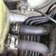 U. (Optional) detach the power steering return line hose from the reservoir and move it to the firewall