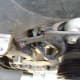 T. Remove alternator bracket bolt and bracket.