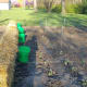 Bales with my warm water buckets and some broccoli and cabbage planted in the soil the normal method.