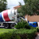 For our size of patio, it took 3 cement trucks plus a small unit that pumped the concrete through large, flexible tubing to our backyard.