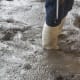 The workers wore rubber boots to move around in the liquid concrete.