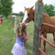 Audrie's careful not to get a horse bite.