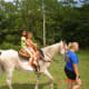 My granddaughter and niece on an old mare.