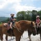 Two of the grands about to go trail riding. Notice the riding helmets?