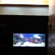 The aquarium in its cabinet.