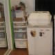Mini- Fridge to house open baby foom, mealworms, frozen mice, etc.; incubator; packing supplies to left.