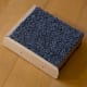 Scrap wood covered in carpet (with trim on edge).