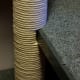 String wrapped around the tube, even around the cutout slots.