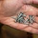 Clout nails are just as good as upholstery pins for the carpet. They are short and have large heads to retain the material.