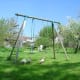Goslings trimming the grass around the swings in our play area