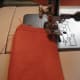 Step 2. Fold the fabric rectangle in half lengthwise. Sew two sides closed, leaving short bottom side open.