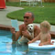 Lyndon B. Johnson holding Yuki, his mixed breed dog.