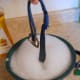 Submerge the collars/leashes in soap water