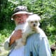 A Maltese with his senior citizen.