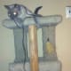 Both cats enjoying a cat tower.