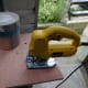 Five-liter (one gallon) paint pot used to mark the cat's play hole, which is then cut out with a jig saw.