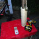 Sliding the cylinder scratch rope down the support post.
