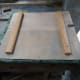 Back of cat flap insulator with pull handles and bolt fitted.
