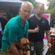 Valuable volunteer with just one of the adoptable dogs from MCAS