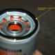 Spread a layer of oil on the rubber seal to ensure a tight seal.
