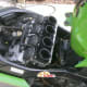 The air cleaner is off and carburetors exposed.