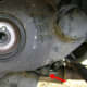 Crankshaft pulley removed and the lower timing belt cover left exposed.