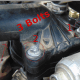Remove bolts from thermostat retainer.