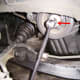 D. Crankshaft pulley removal. If using the ground to secure the bar, the bar should be at 5 o'clock, not 7 o'clock as shown here. The engine rotates clockwise.