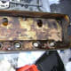 Valve cover before new spark plug gasket and valve cover gasket replacement.