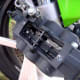The plate is off, revealing the pin and cotter key to be removed.