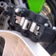 Back side of the caliper, showing the metal plate to be removed.