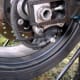 Removing the first bolt with an allen wrench