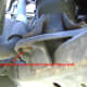 Remove the lower motor mount bolt.