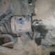 A great view of the axle going into the transmission. You can see the transmission fluid starting to leak down the transmission case.