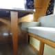 The original brown & orange cushions shown in the vintage sales manual I got with the trailer are still under the slipcovers I made. More storage is available below the benches.