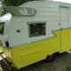 Back around to curbside. The louvered windows all work, and the storage cabinet holds the vintage leveling jacks that came with her.