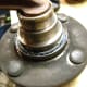 Y. Secure wheel hub to bench
