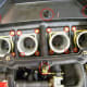 Remove screws from air cleaner housing, remove air funnels, remove screws that attach each carburetor to the air cleaner housing (circled in red)