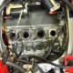 Rocking the carburetor assembly up and down will free them from the rubber insulators.