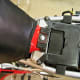 Remove the rear gas tank bolt (circled in red) .