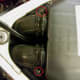 Loosen screws on air duct clamps (circled in red), disconnect air duct hoses from the air cleaner cover.