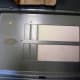 Blank spaces in the panel cover that may need removed for your new breaker.