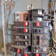 Installing a breaker. The left side (nearest the edge of the panel) is hooked into the framework and it is being pushed down in the center. It may take some force.